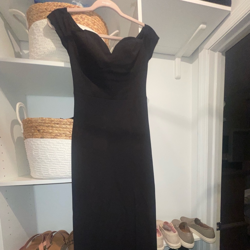 Windsor black formal dress with high slit and sweetheart neckline.